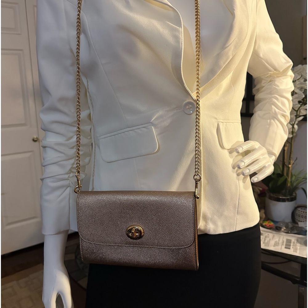 Coach cross body bag. Rose Gold